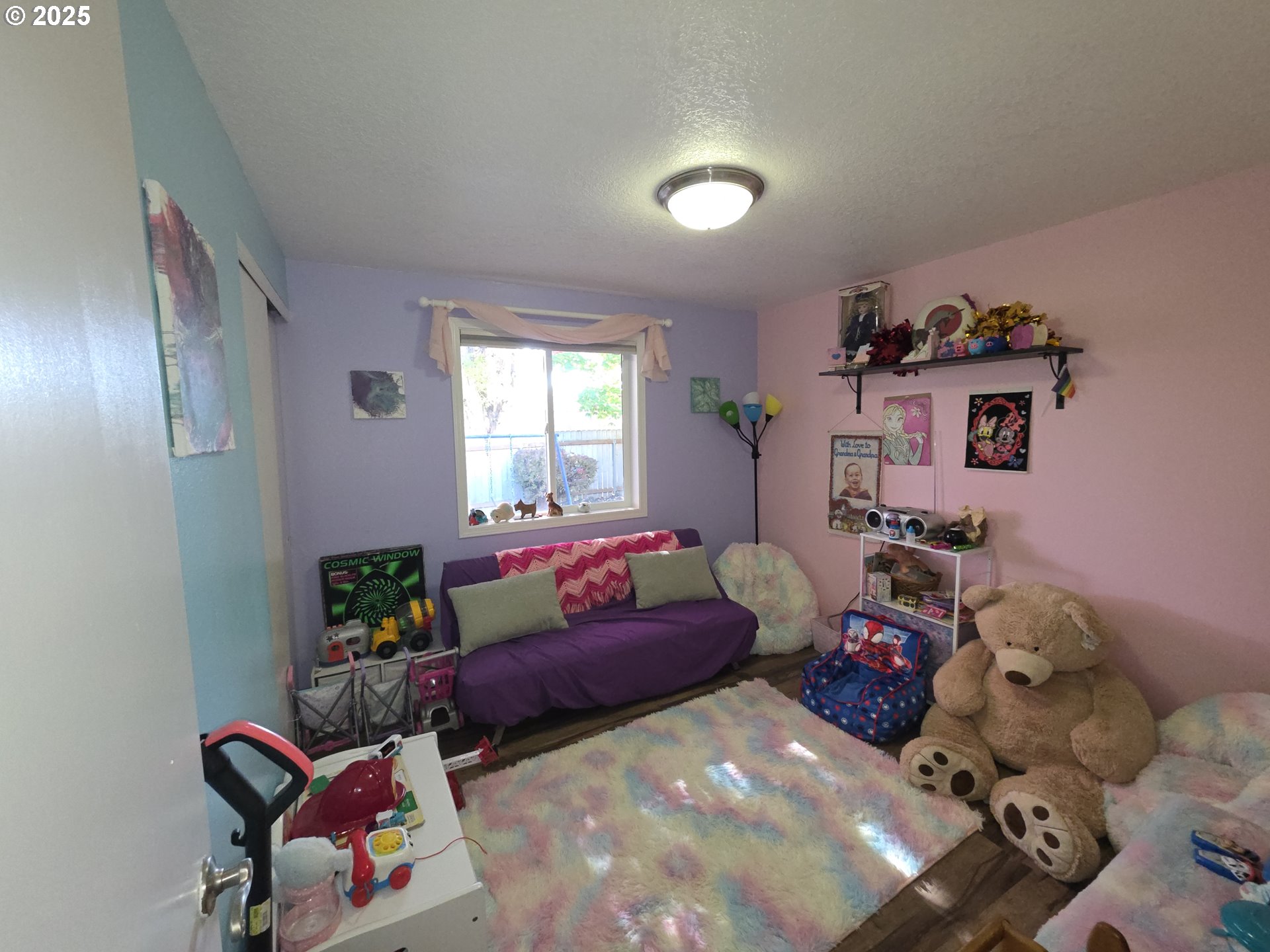 413 Southeast 8th Street Battle Ground, WA 98604 - Photo 16 of 18 a bedroom with furniture and a window