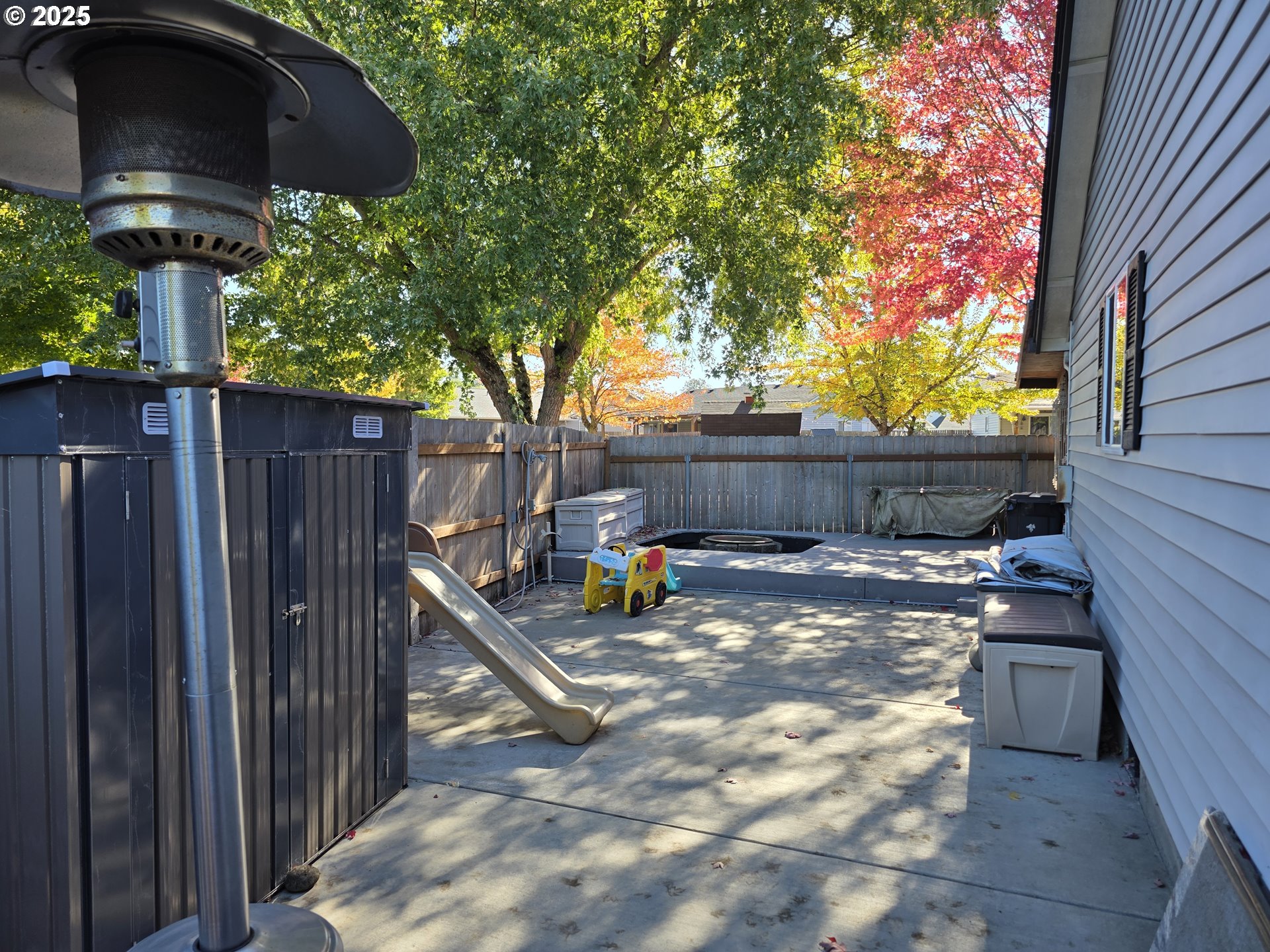 413 Southeast 8th Street Battle Ground, WA 98604 - Photo 9 of 18 a backyard of a house with table and chairs