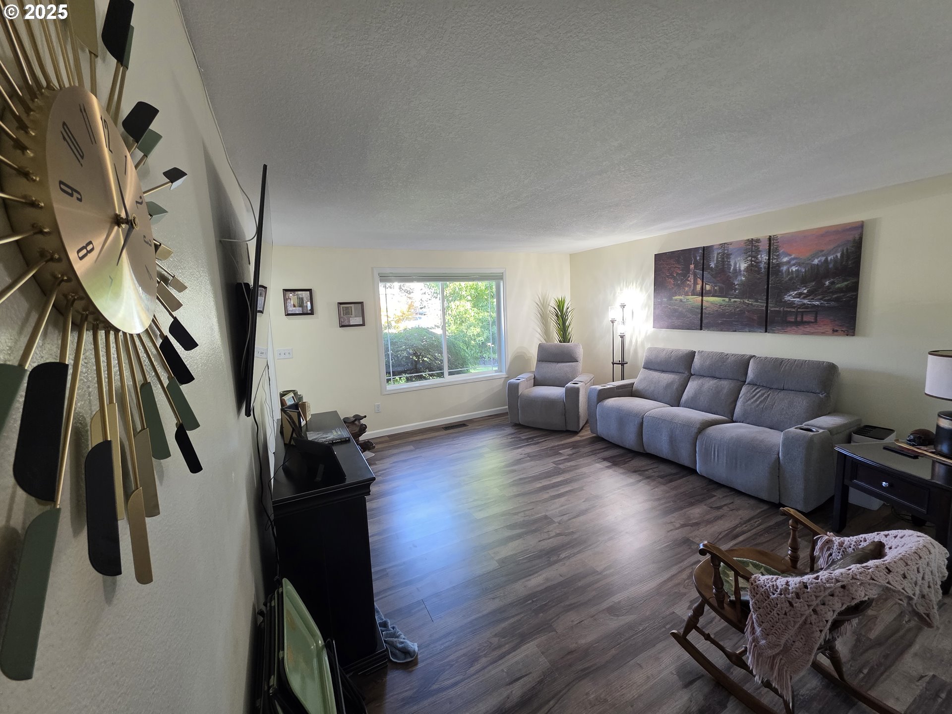 413 Southeast 8th Street Battle Ground, WA 98604 - Photo 10 of 18 a living room with furniture and a large window