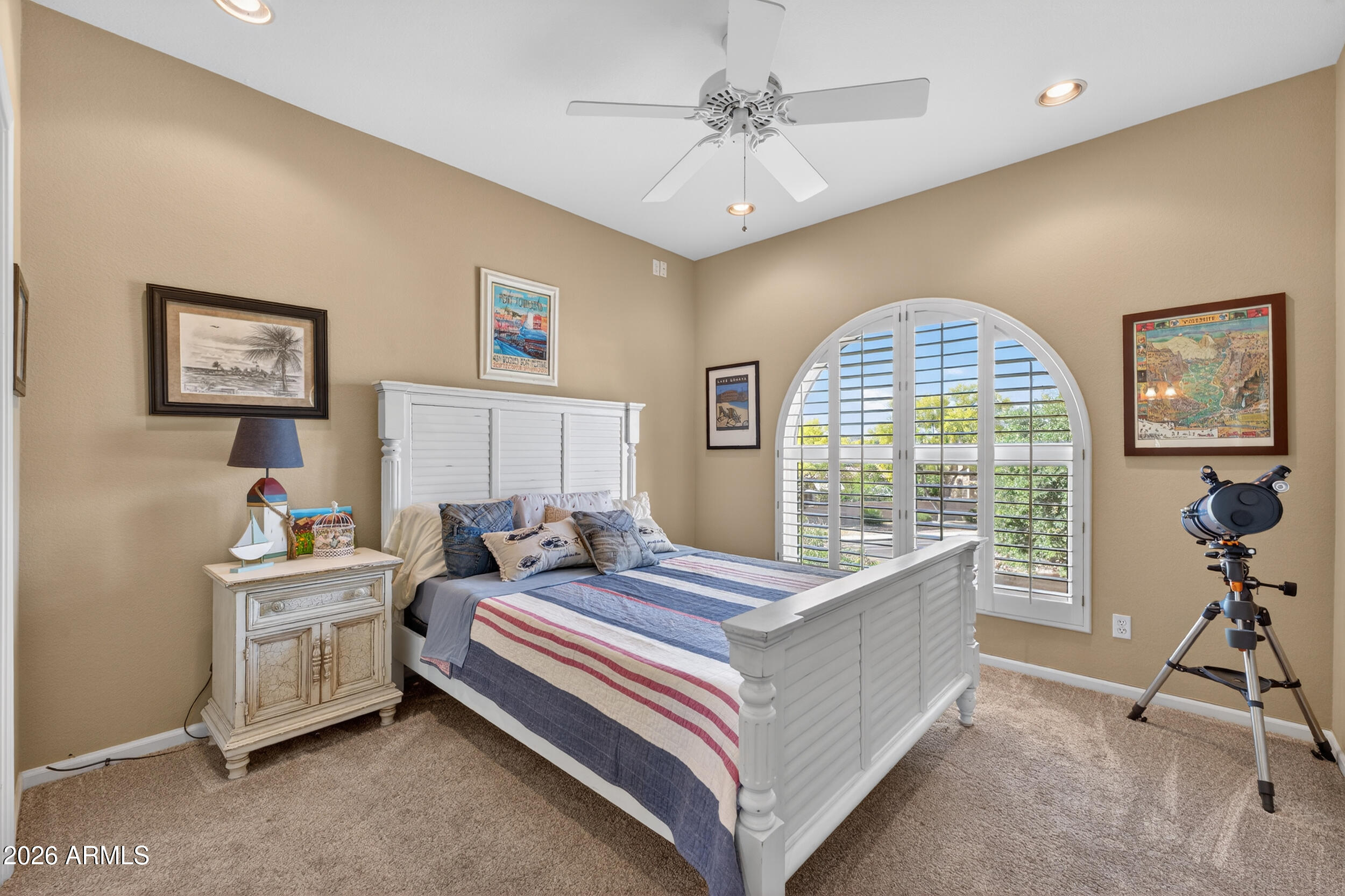 1539 East Winged Foot Road Phoenix, AZ 85022 - Photo 39 of 64 a bed room with a bed and a chandelier