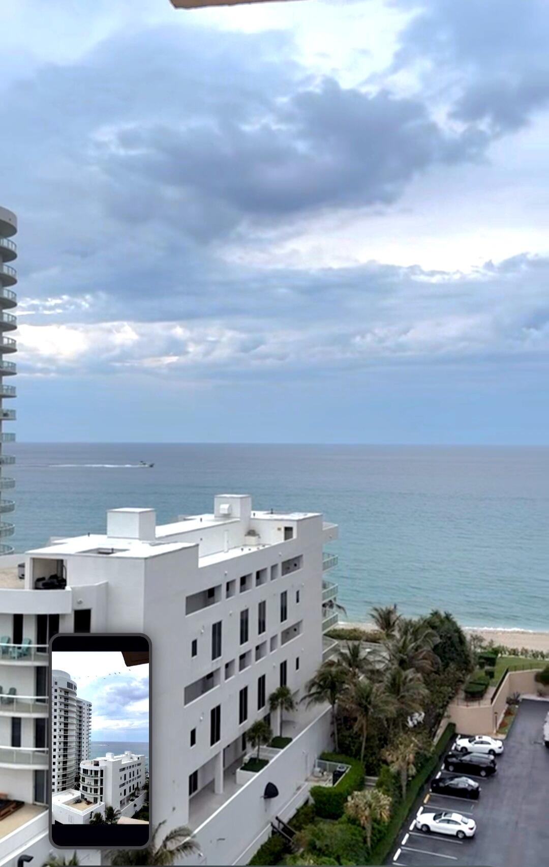 a view of building with ocean