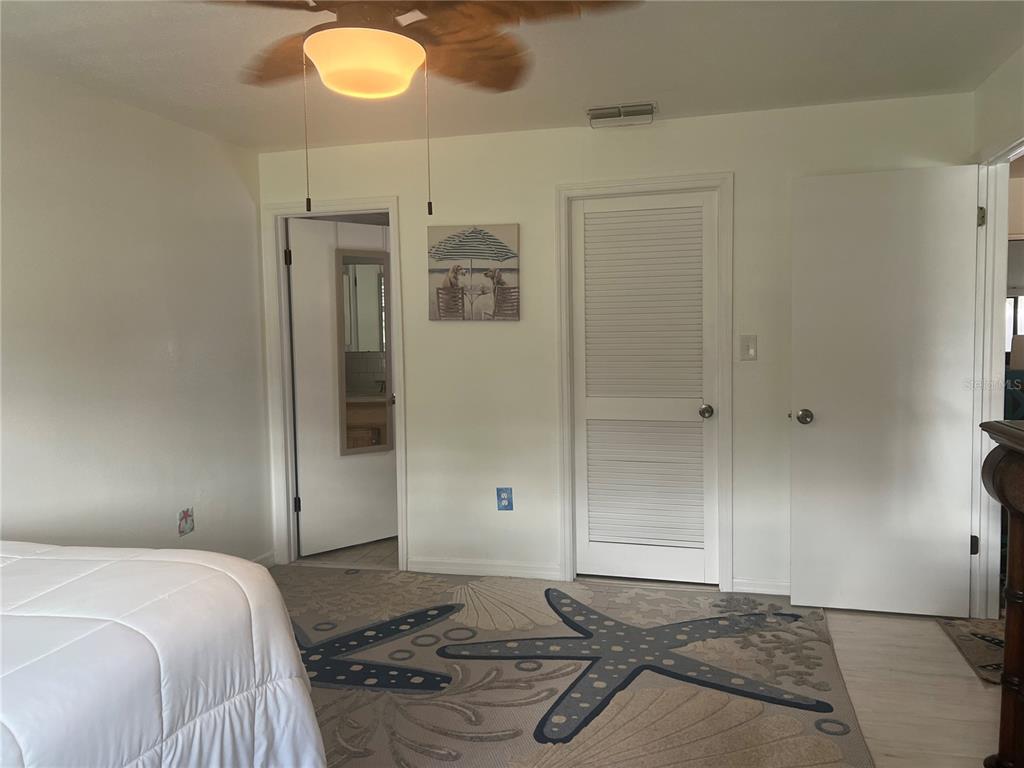 11375 Corrigan Street Spring Hill, FL 34609 - Photo 16 of 36 a bedroom with a bed and a window