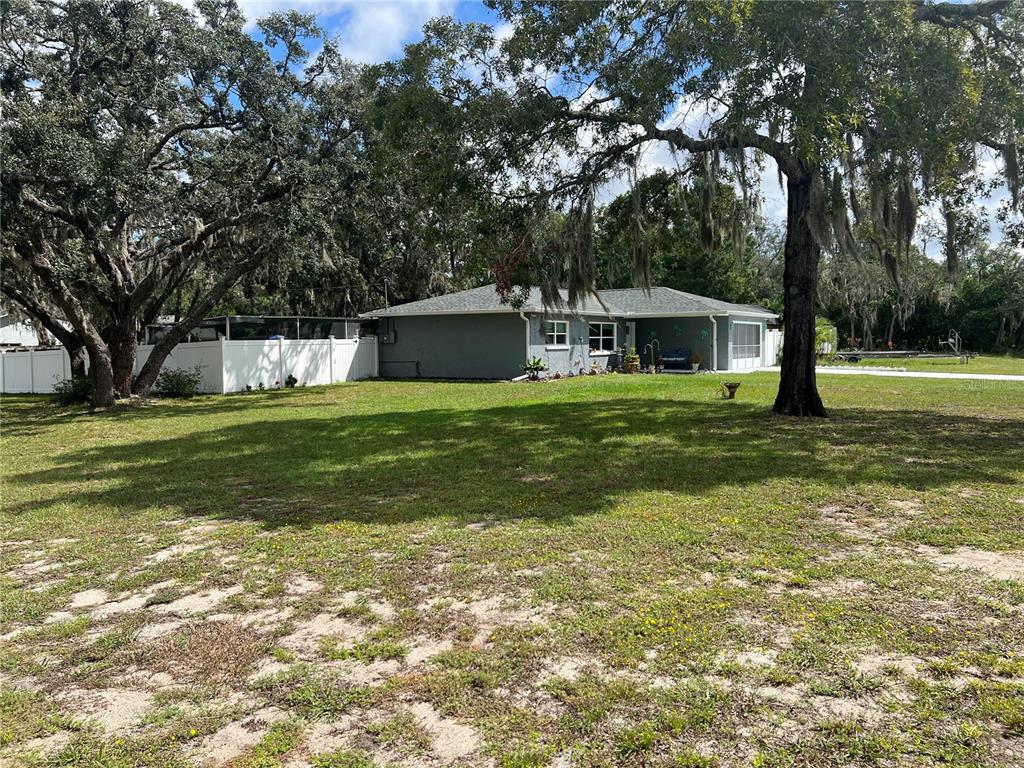 11375 Corrigan Street Spring Hill, FL 34609 - Photo 2 of 36 a view of a house with a big yard