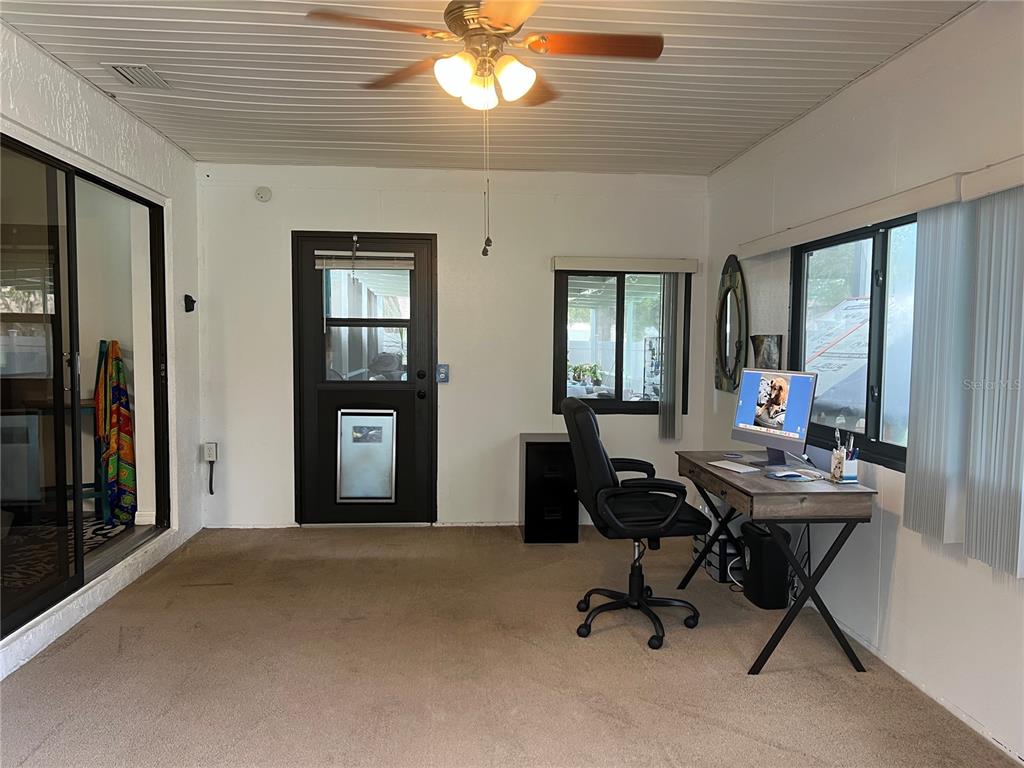 11375 Corrigan Street Spring Hill, FL 34609 - Photo 22 of 36 a view of a workspace with furniture and a window