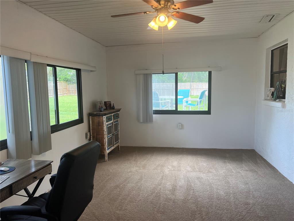 11375 Corrigan Street Spring Hill, FL 34609 - Photo 23 of 36 a view of a livingroom with a window