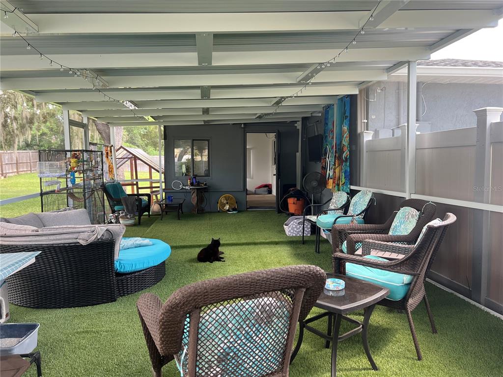 11375 Corrigan Street Spring Hill, FL 34609 - Photo 26 of 36 a room with furniture and a potted plant