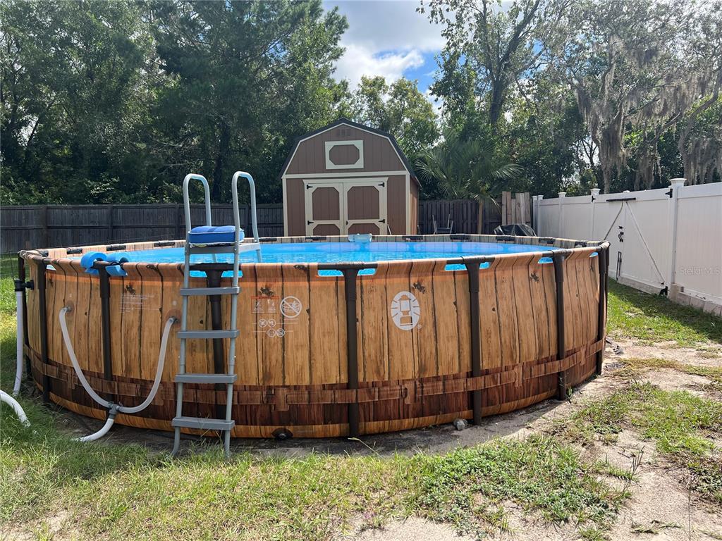 11375 Corrigan Street Spring Hill, FL 34609 - Photo 29 of 36 a front view of a house with garden