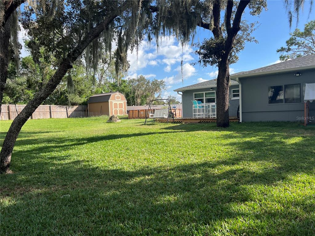11375 Corrigan Street Spring Hill, FL 34609 - Photo 33 of 36 a house view with a sitting space and garden