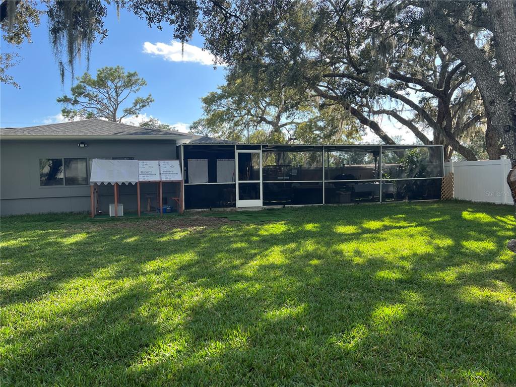 11375 Corrigan Street Spring Hill, FL 34609 - Photo 34 of 36 a house view with a sitting space and garden