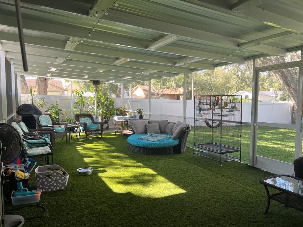 11375 Corrigan Street Spring Hill, FL 34609 - Photo 35 of 36 a swimming pool with outdoor seating and yard