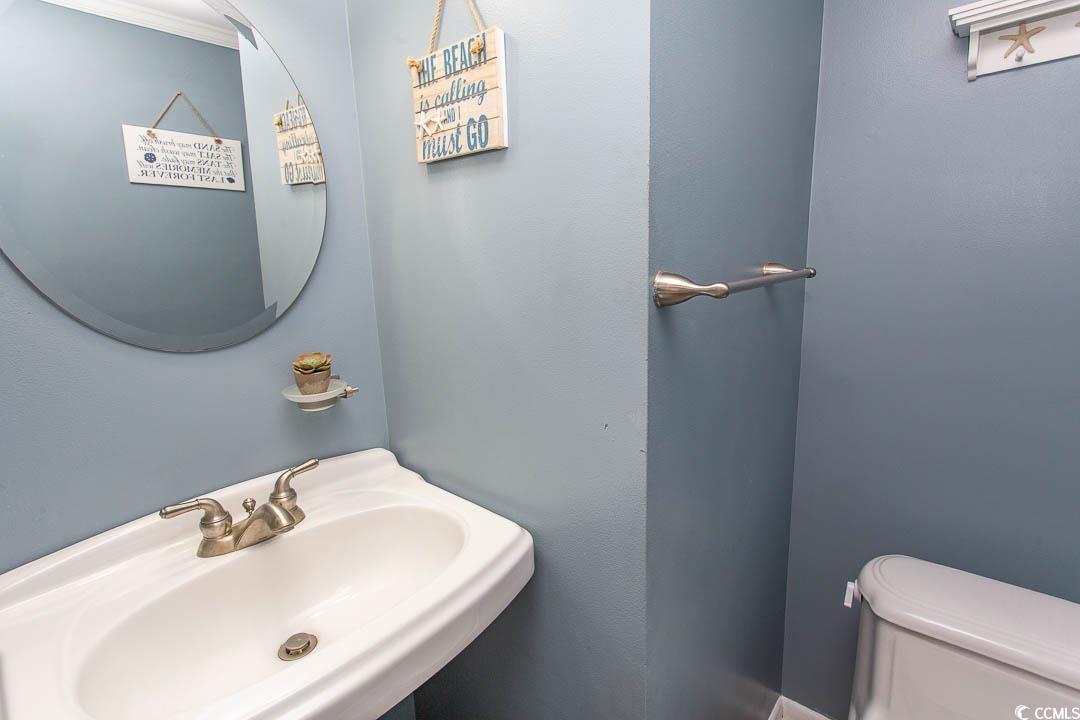 4115 Little River Road, Unit 4F Myrtle Beach, SC 29577 - Photo 16 of 38 Bathroom featuring a sink and toilet