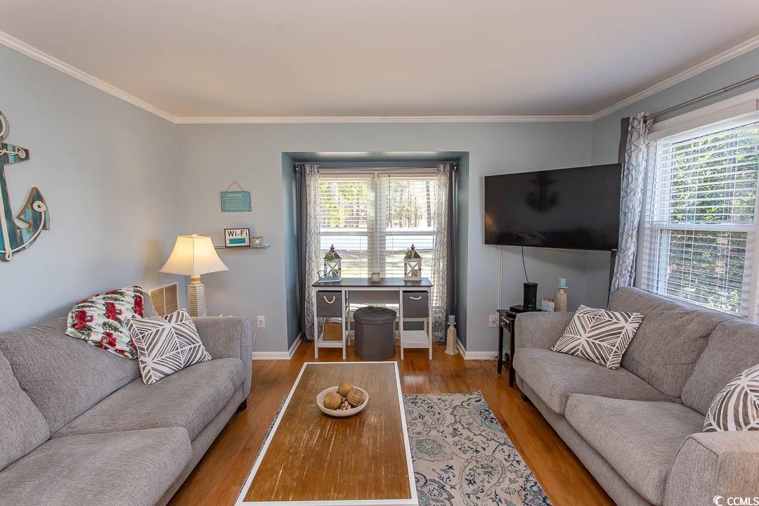 4115 Little River Road, Unit 4F Myrtle Beach, SC 29577 - Photo 3 of 38 Living area with crown molding, plenty of natural