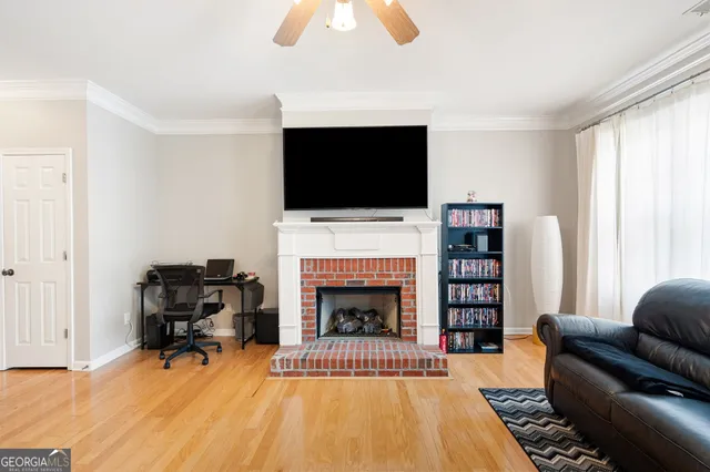 a living room with furniture fireplace and a flat screen tv