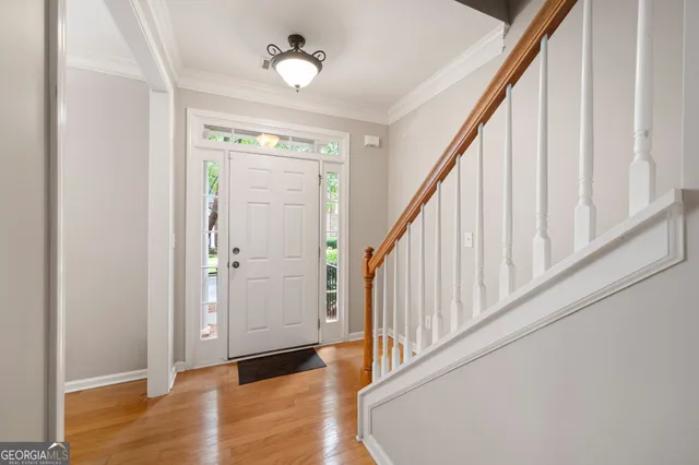 a view of a dining room with furniture wooden floor and chandelier
