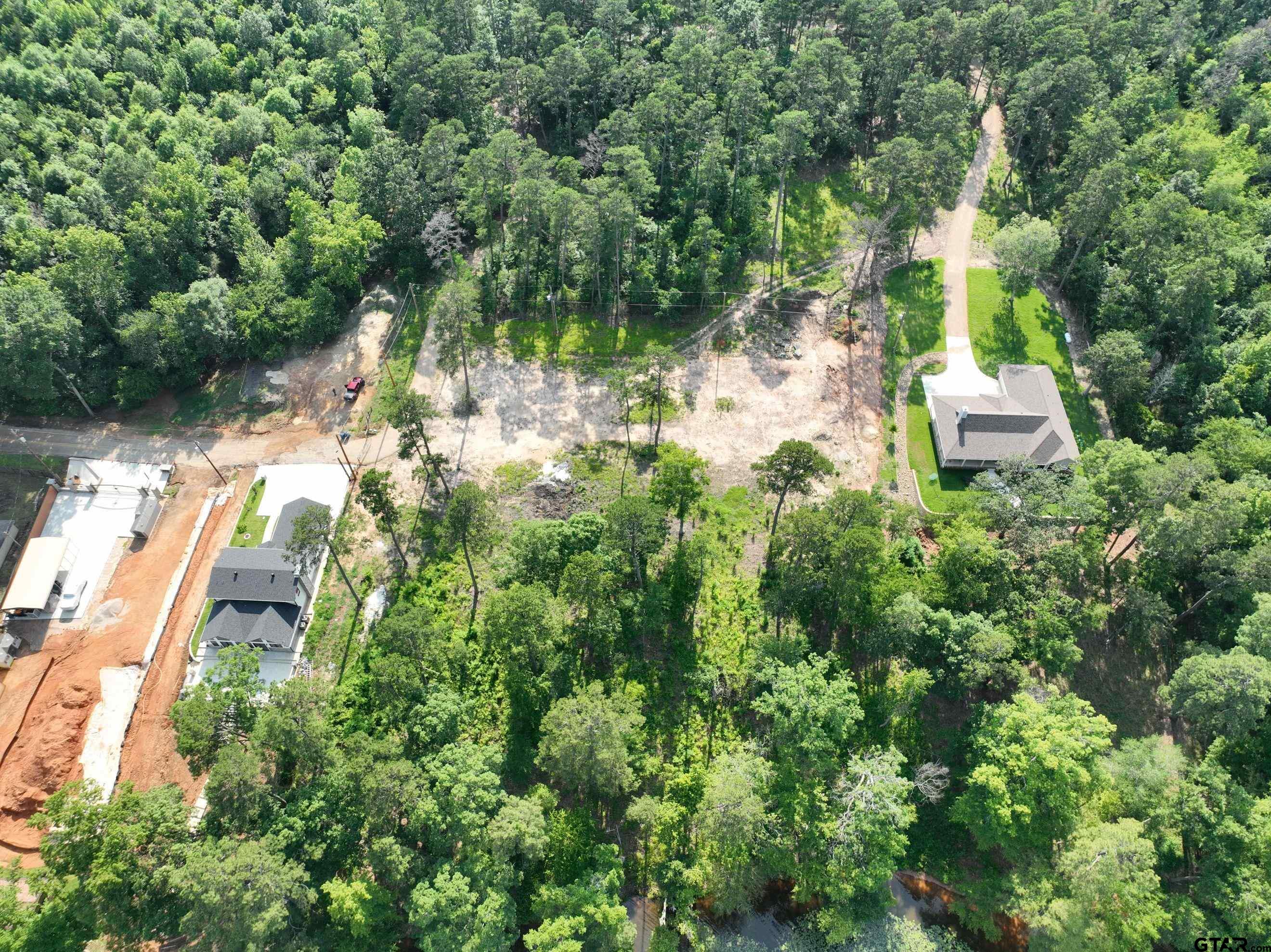 Tbd Pine Hills Road Gladewater, TX 75647 - Photo 3 of 10 an aerial view of residential house with outdoor space and trees all around