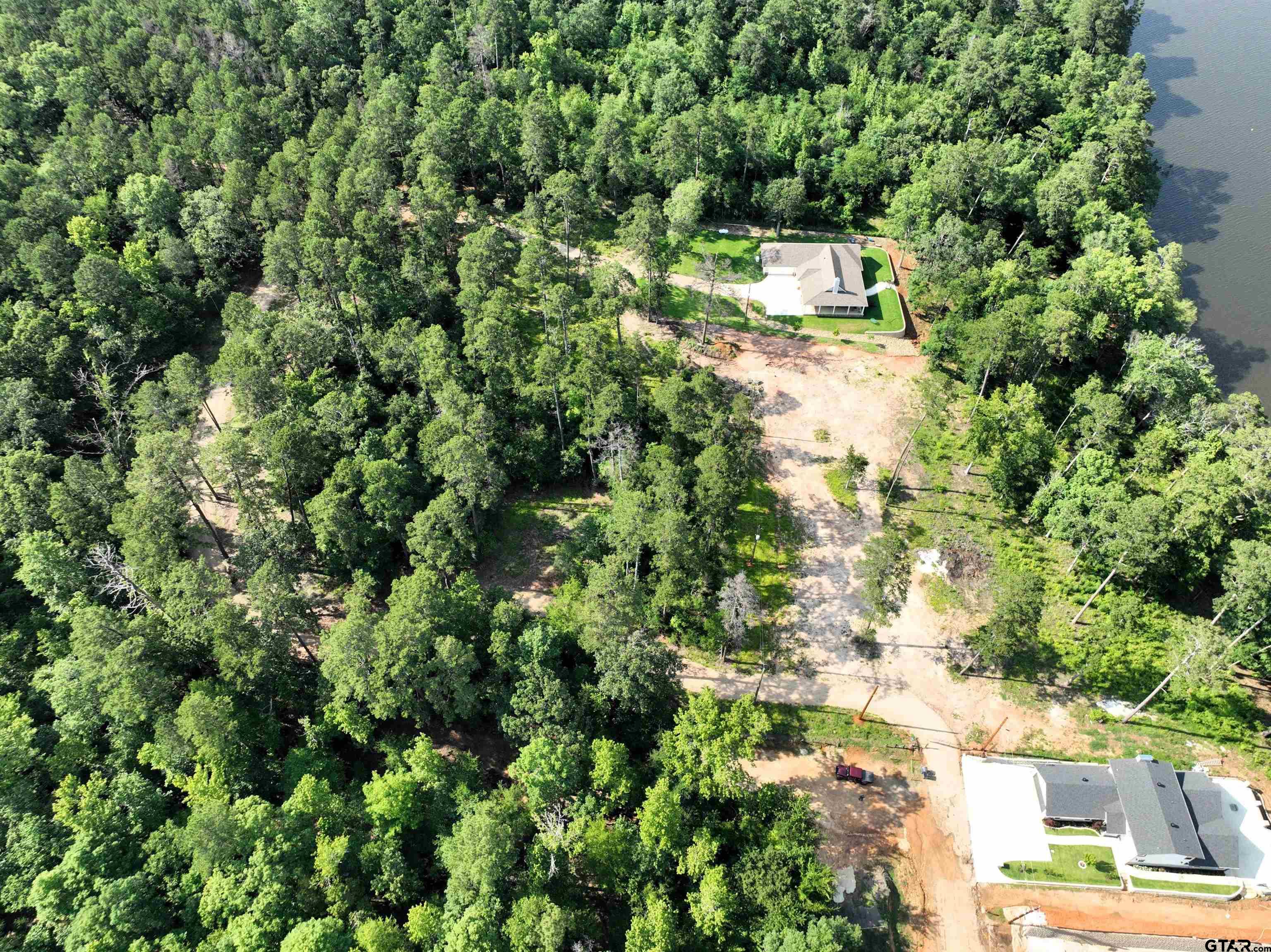 Tbd Pine Hills Road Gladewater, TX 75647 - Photo 4 of 10 an aerial view of residential house with outdoor space and trees all around