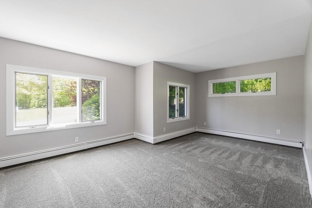 115 Mill Street Lincoln, MA 01773 - Photo 8 of 16 an empty room with windows