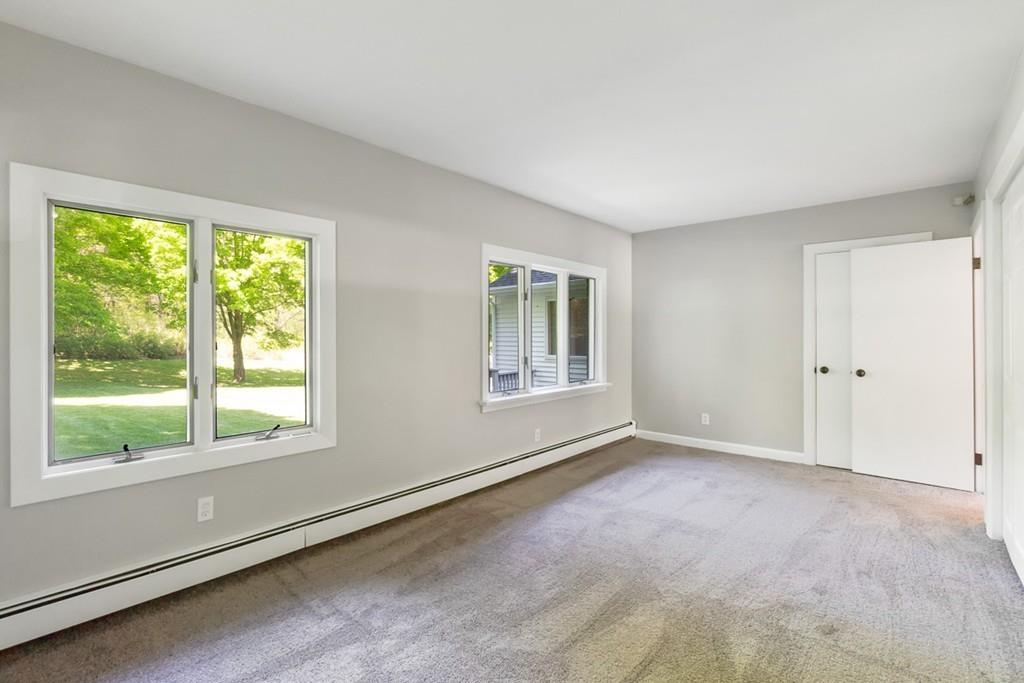 115 Mill Street Lincoln, MA 01773 - Photo 9 of 16 a view of an empty room with a window