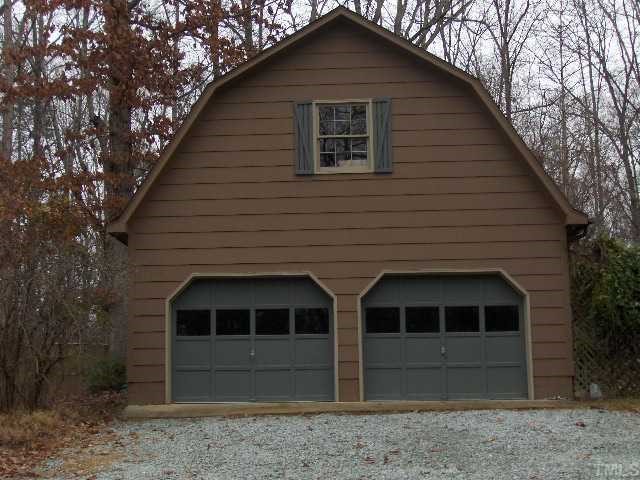 5712 Roslyn Road Durham, NC 27712 - Photo 3 of 3 Extra large deck off the back of wooded, private lot.