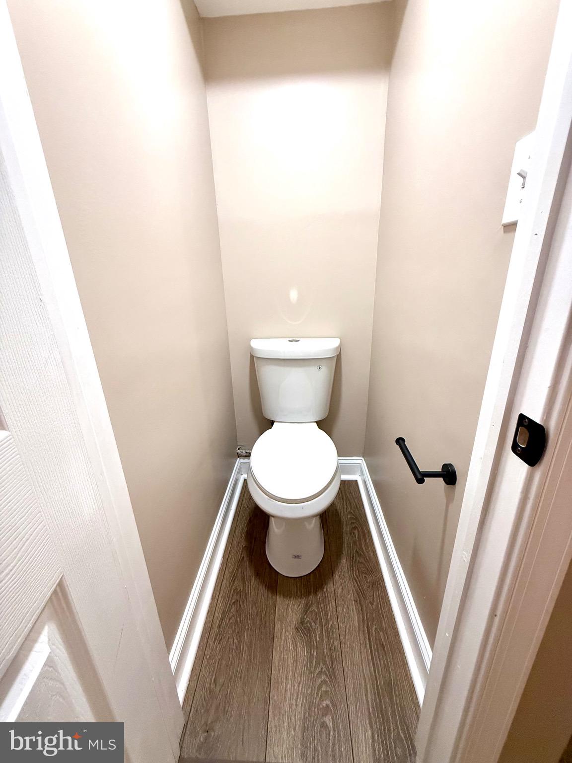 8103 Gray Haven Road Baltimore, MD 21222 - Photo 12 of 14 a bathroom with a toilet and a sink