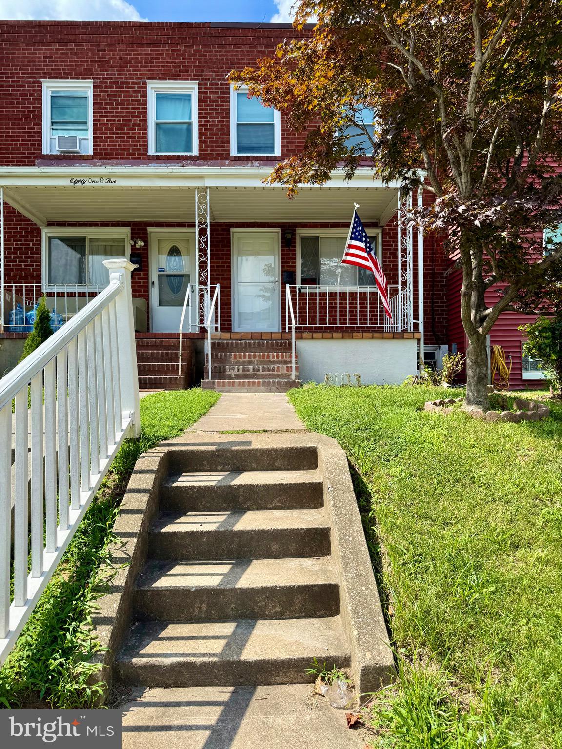 8103 Gray Haven Road Baltimore, MD 21222 - Photo 2 of 14 a front view of a house with a yard porch