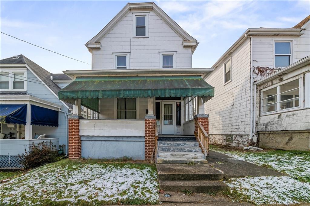 325 Walnut Street Vandergrift, PA 15690 - Photo 2 of 29 a front view of a house with garden