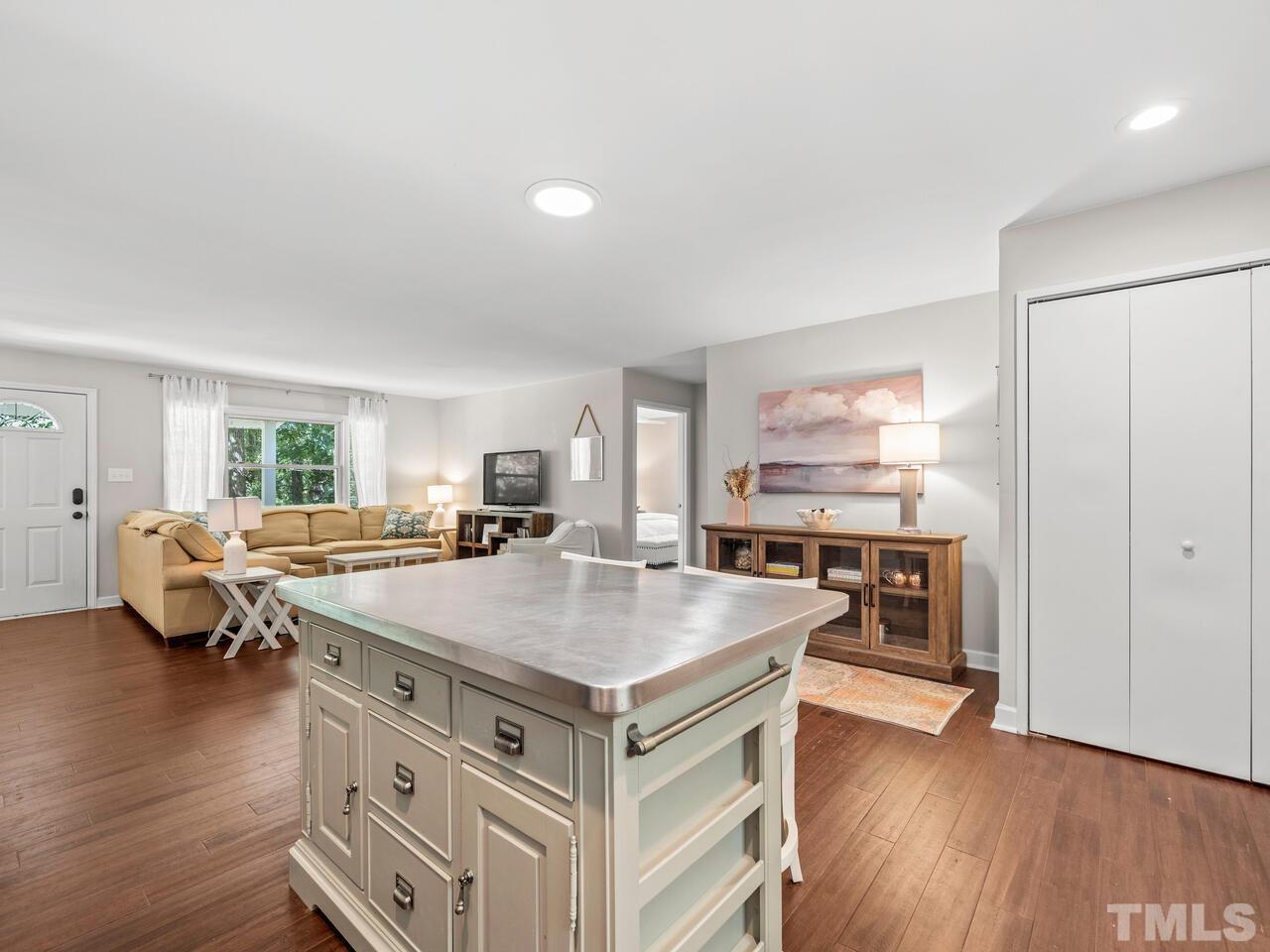 430 Obie Drive Durham, NC 27713 - Photo 11 of 35 a open kitchen with stainless steel appliances granite countertop a stove and a refrigerator