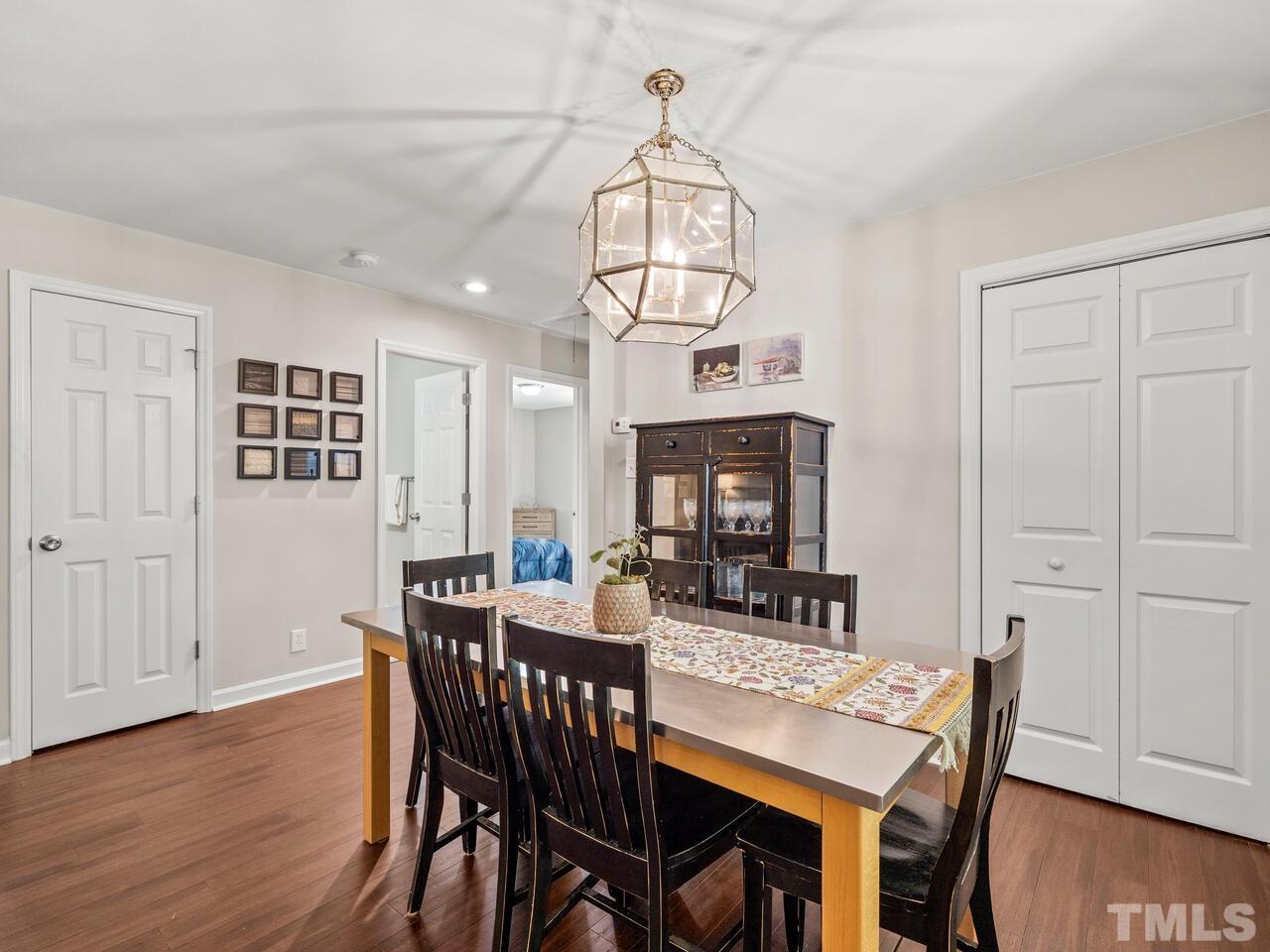 430 Obie Drive Durham, NC 27713 - Photo 14 of 35 a view of a dining room with furniture wooden floor and chandelier