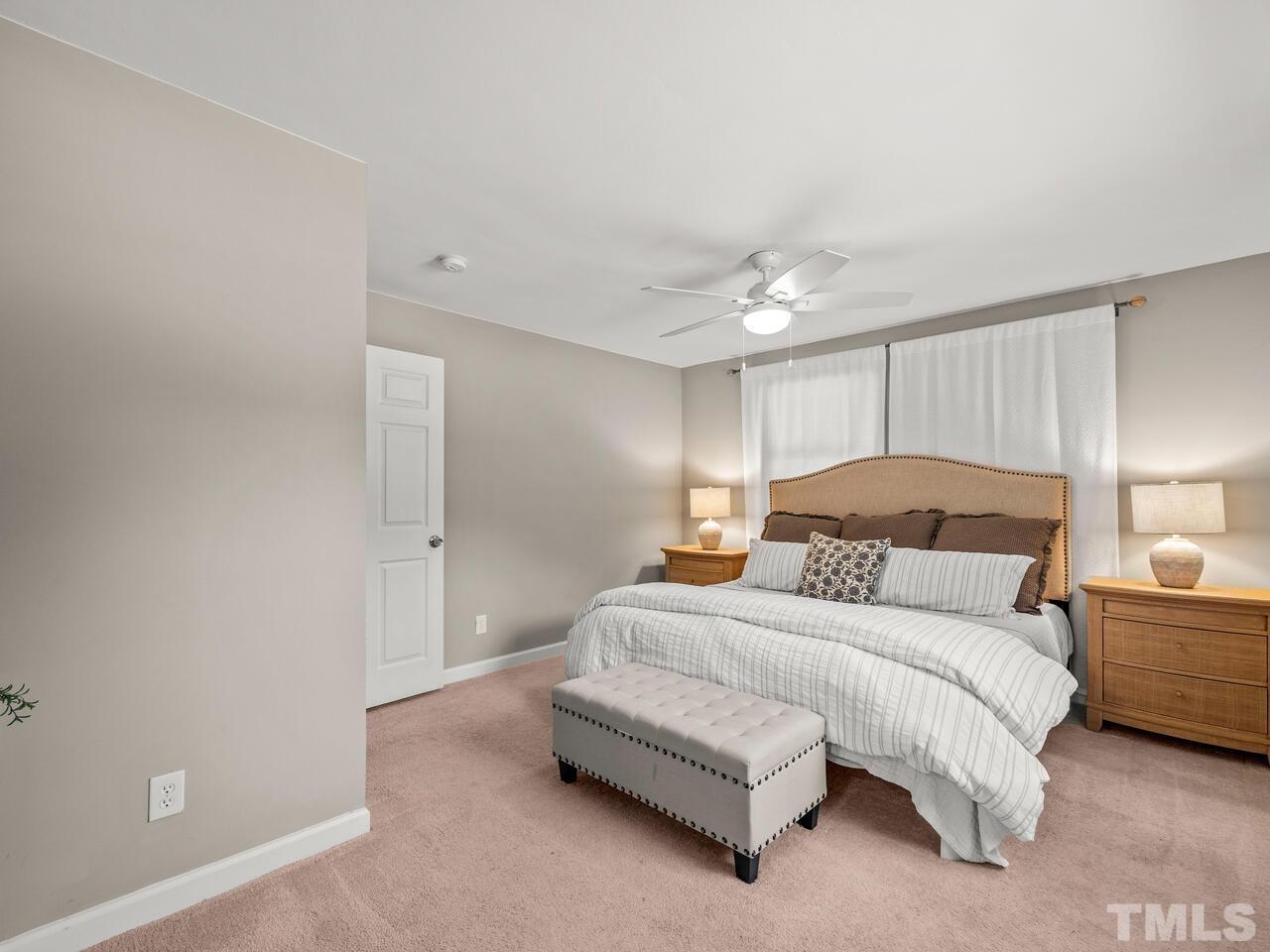 430 Obie Drive Durham, NC 27713 - Photo 17 of 35 a spacious bedroom with a bed and a lamp