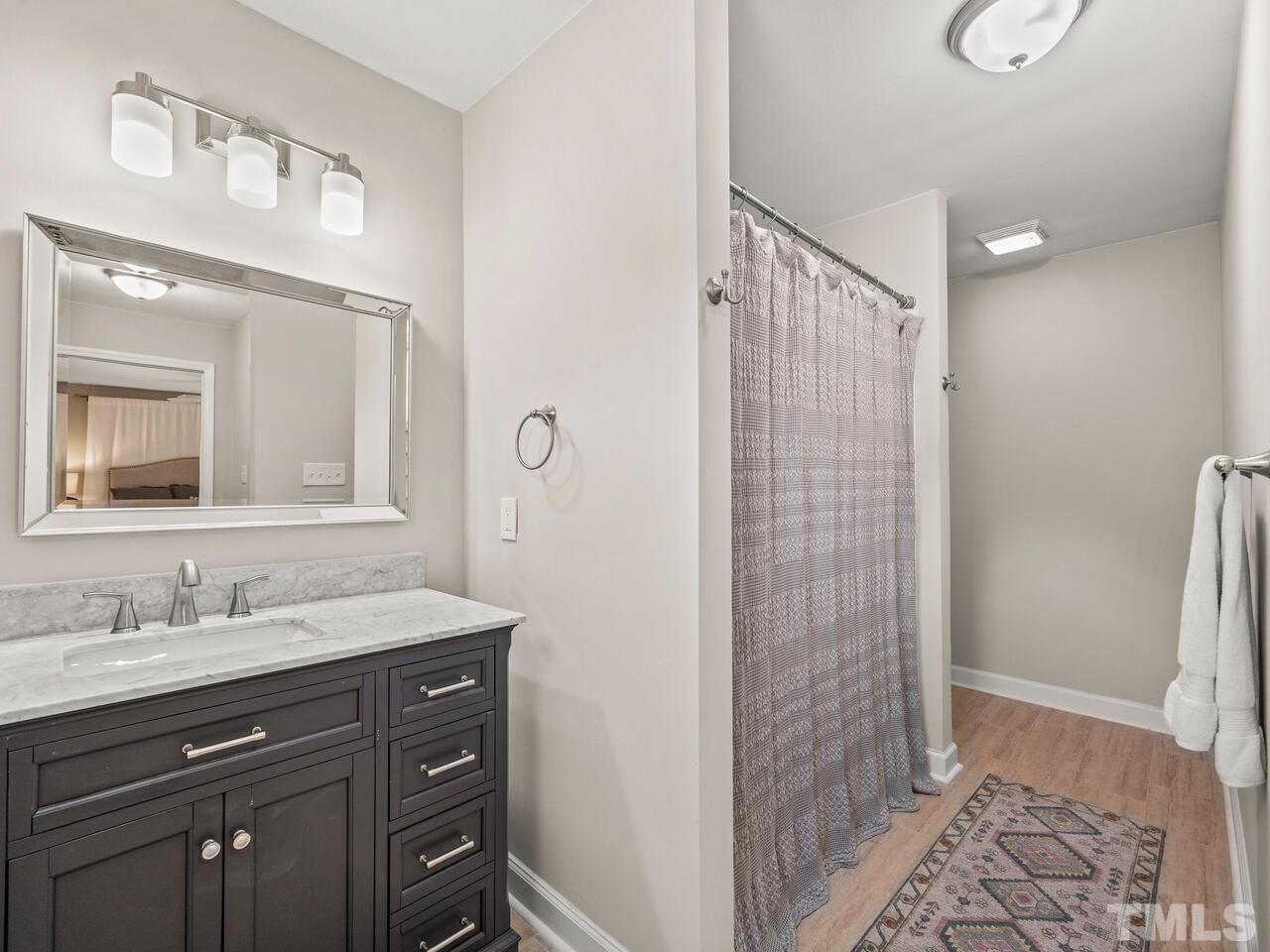 430 Obie Drive Durham, NC 27713 - Photo 19 of 35 a bathroom with a sink and a mirror