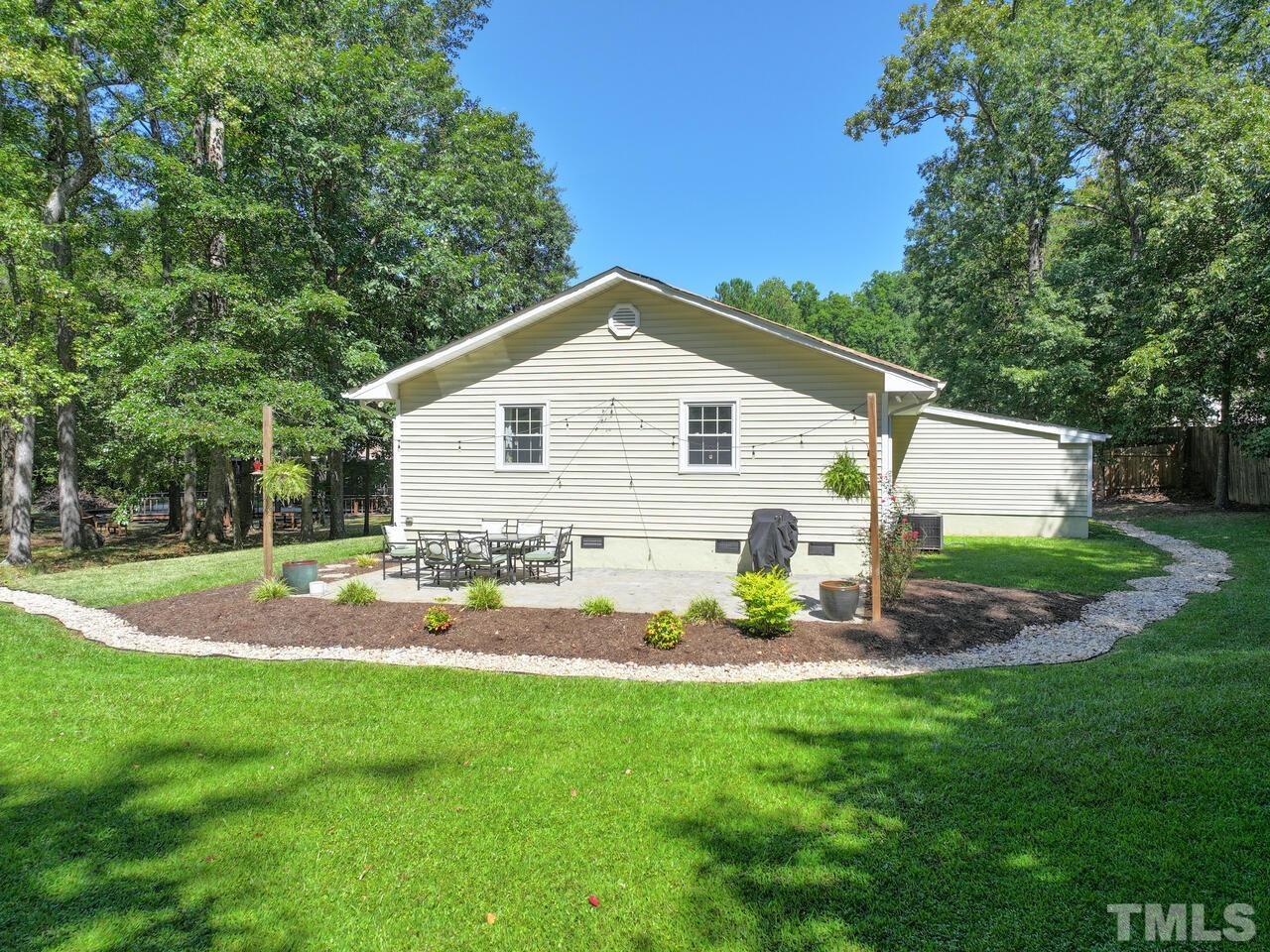 430 Obie Drive Durham, NC 27713 - Photo 28 of 35 a view of a backyard with plants and large tree