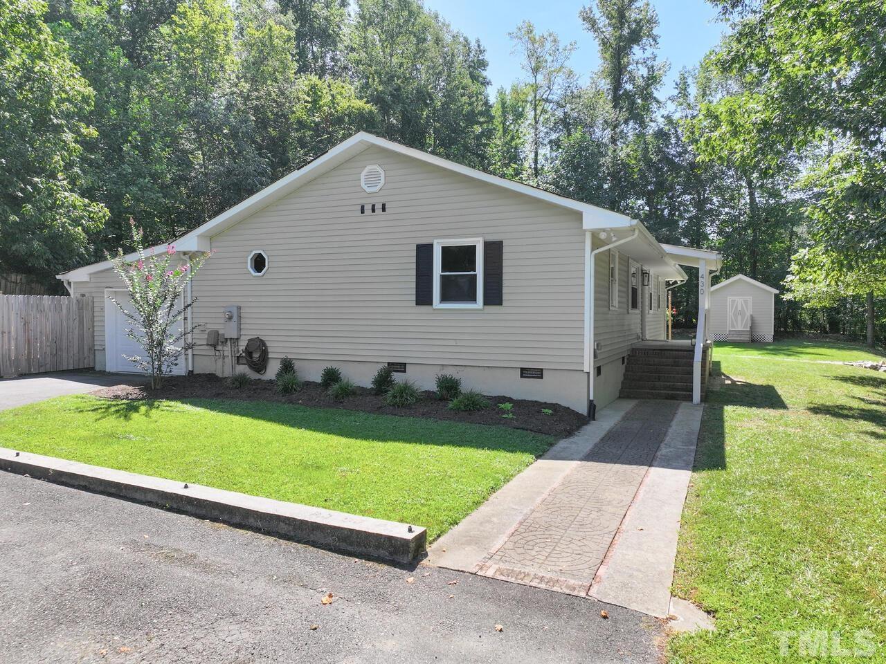 430 Obie Drive Durham, NC 27713 - Photo 3 of 35 a front view of house with yard and green space