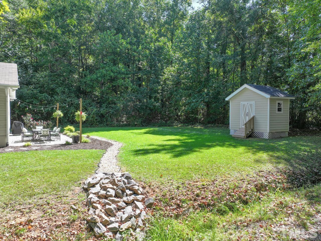 430 Obie Drive Durham, NC 27713 - Photo 31 of 35 a view of a house with backyard and a tree