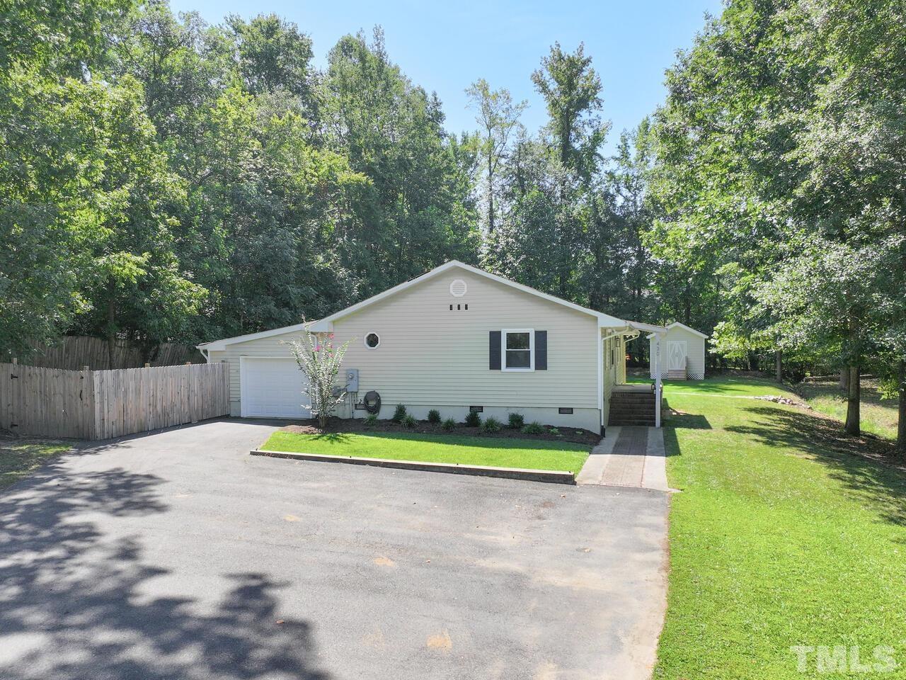 430 Obie Drive Durham, NC 27713 - Photo 4 of 35 a view of a house with a yard and large trees