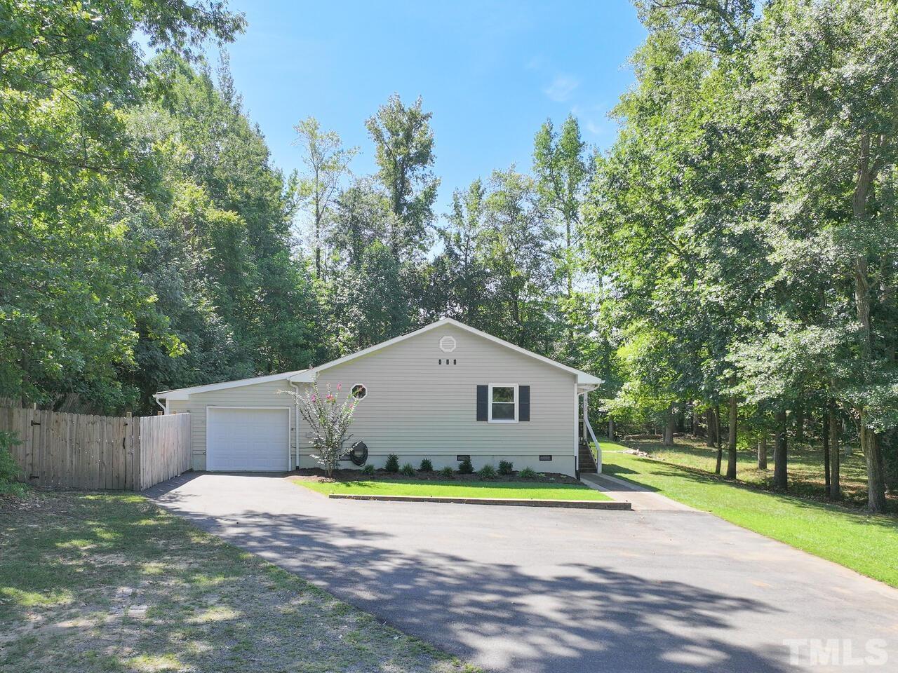 430 Obie Drive Durham, NC 27713 - Photo 5 of 35 a front view of a house with a yard and garage