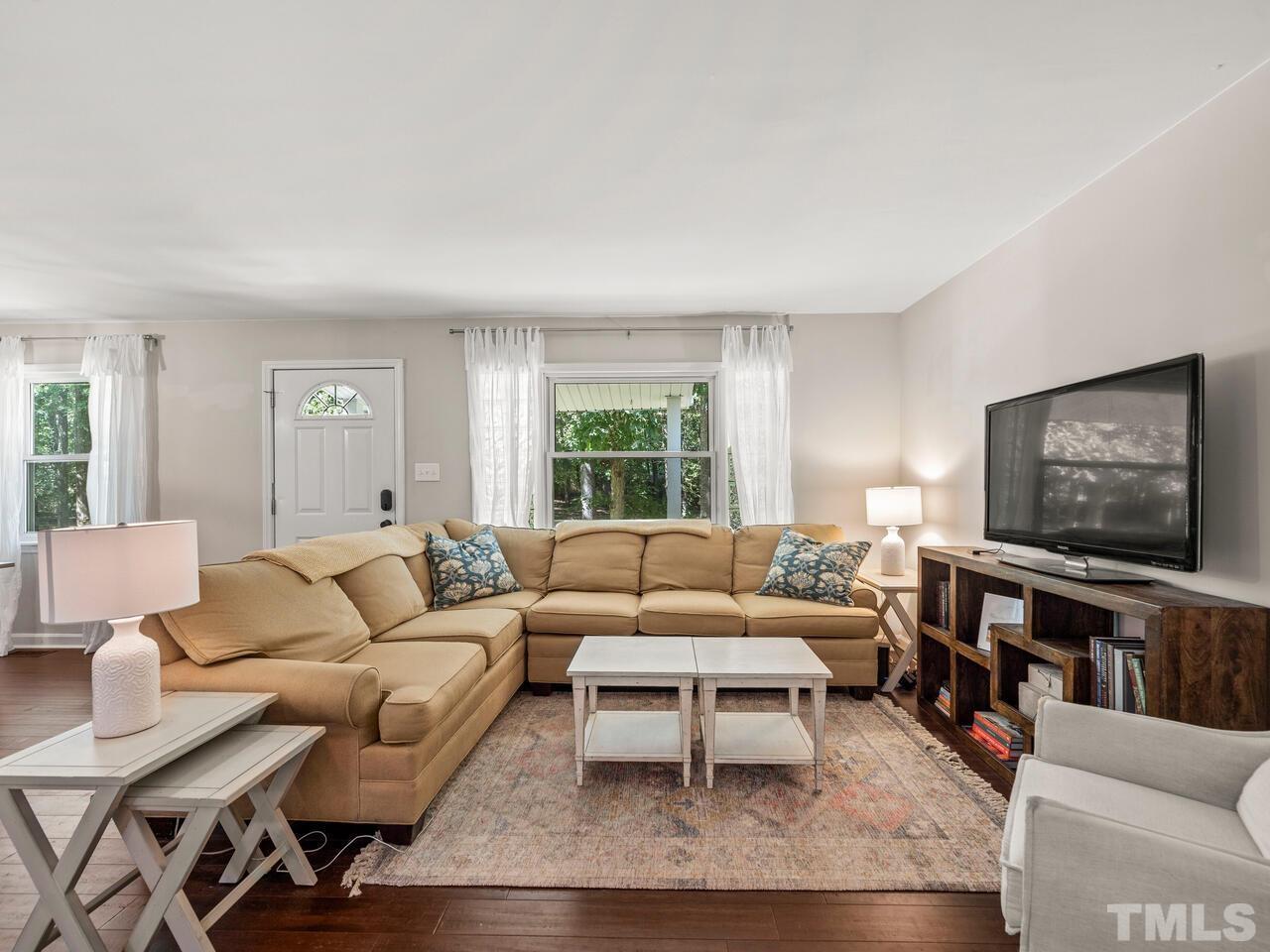 430 Obie Drive Durham, NC 27713 - Photo 6 of 35 a living room with furniture and a flat screen tv
