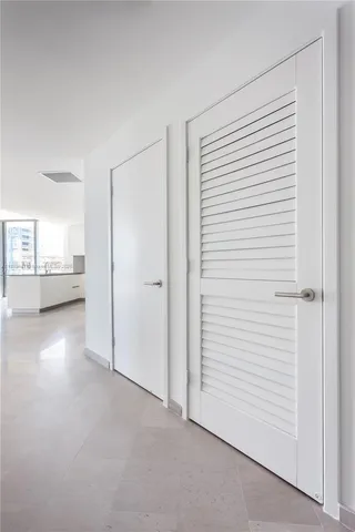 a view of a room with a white walls