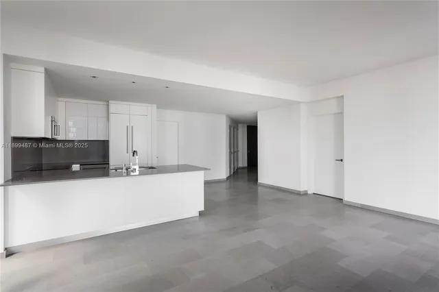 a view of a kitchen with a sink