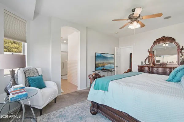 a bed room with a bed and a chandelier