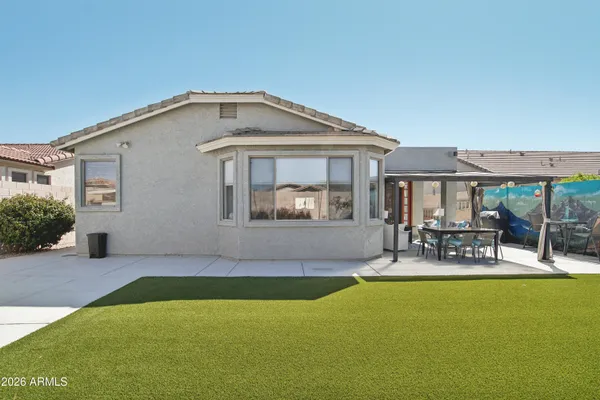 a front view of house with outdoor seating and deck