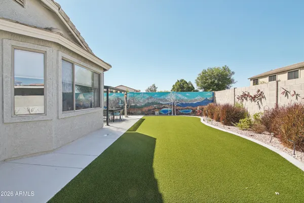 a front view of house with yard and outdoor seating