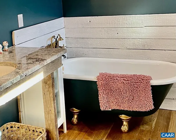 a bathroom with a sink and mirror