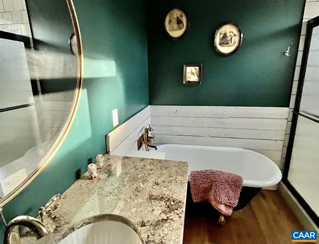 a bathroom with a sink mirror and toilet