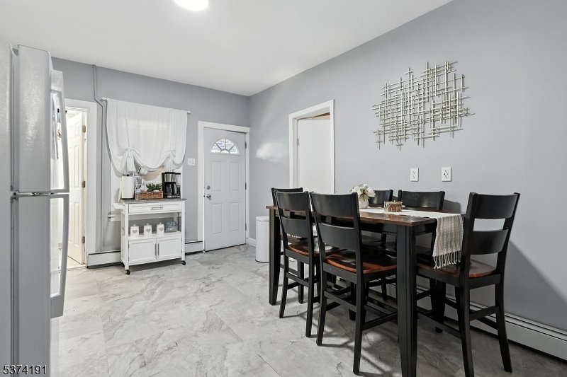 50 Oak Street Paterson, NJ 07501 - Photo 14 of 28 a view of a dining room with furniture and chandelier