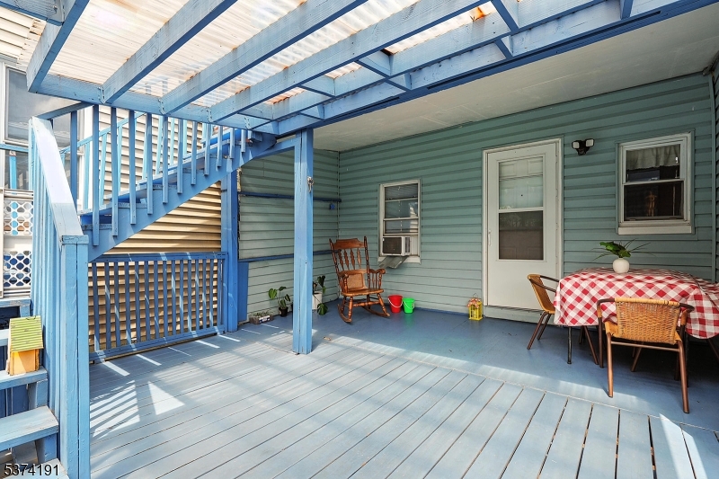 50 Oak Street Paterson, NJ 07501 - Photo 18 of 28 a view of a chairs with wooden deck