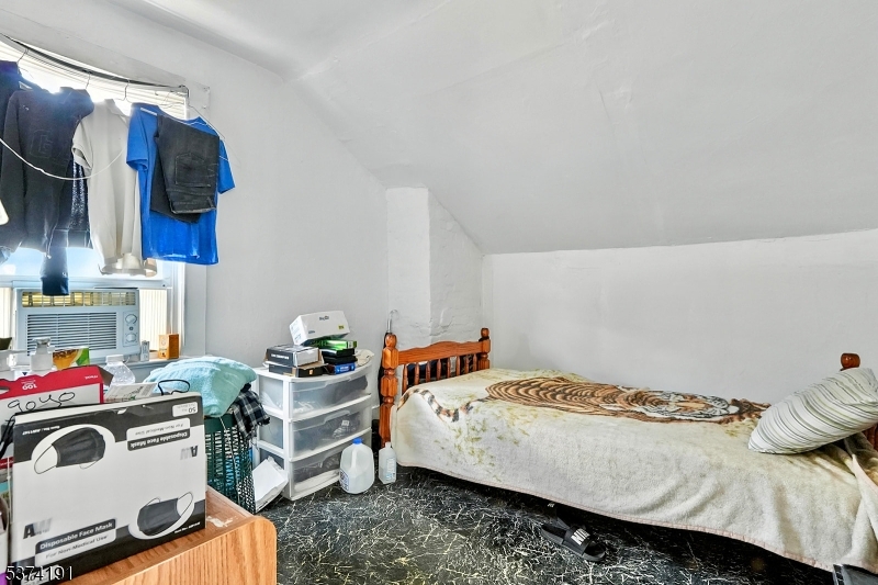 50 Oak Street Paterson, NJ 07501 - Photo 23 of 28 a bedroom with a bed and a couch