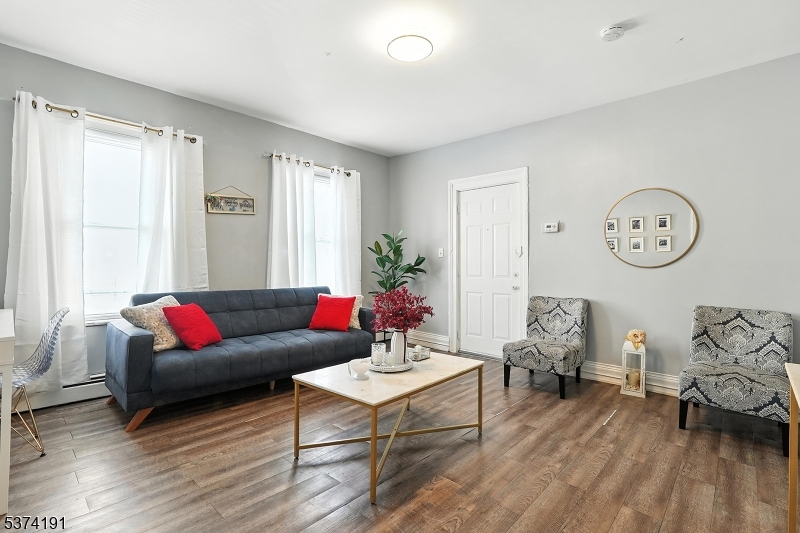 50 Oak Street Paterson, NJ 07501 - Photo 24 of 28 a living room with furniture and wooden floor