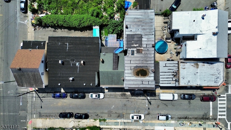 50 Oak Street Paterson, NJ 07501 - Photo 25 of 28 an aerial view of residential houses with outdoor space