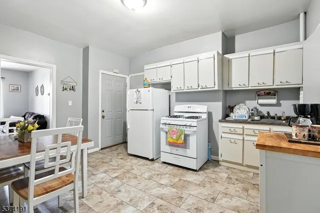 a kitchen with cabinets and appliances