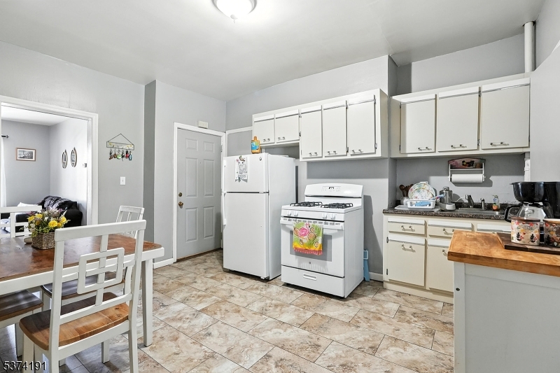 50 Oak Street Paterson, NJ 07501 - Photo 28 of 28 a kitchen with cabinets and appliances